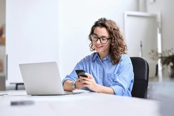 young-happy-business-woman-smiling-600nw-2220115783.webp